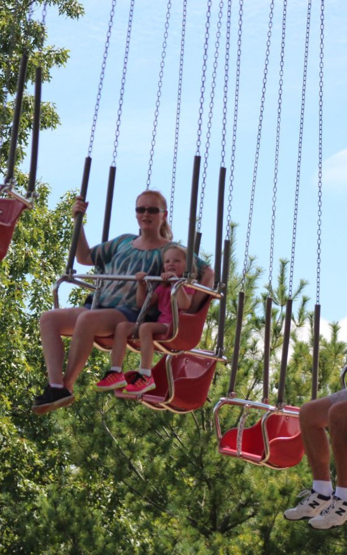 lady and girl on swing ride