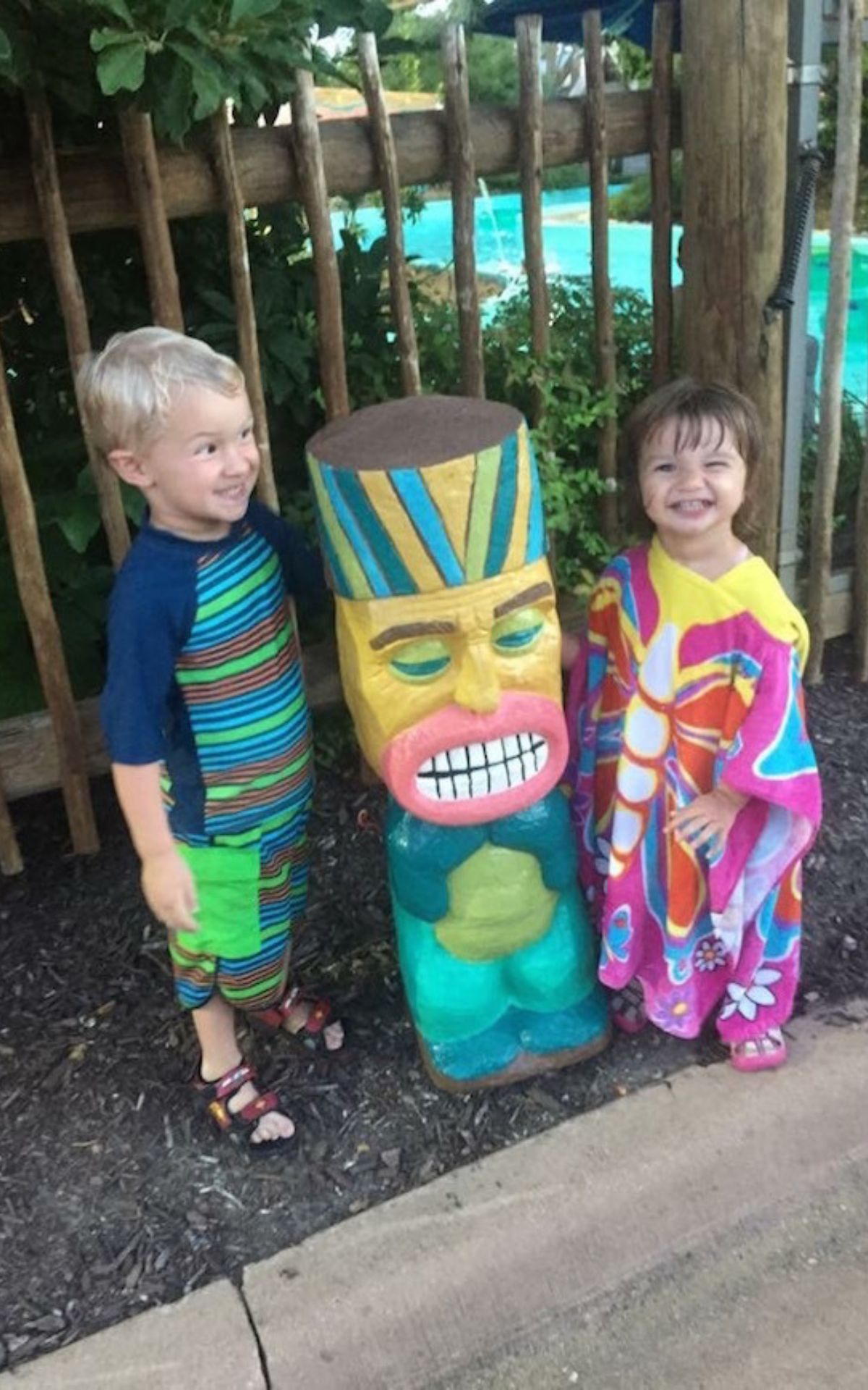 boy and girl with statue